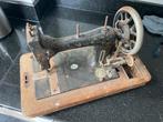 Antieke naaimachine, Ophalen