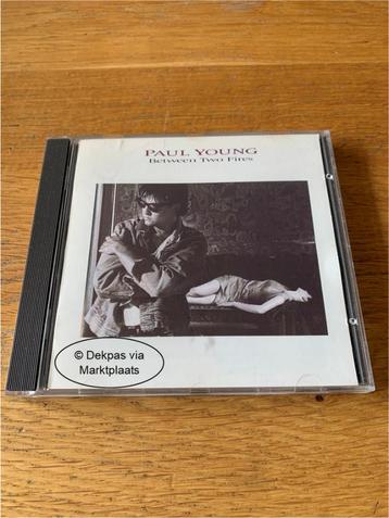 Cd Paul Young - Between Two Fires beschikbaar voor biedingen
