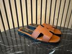 Nieuwe Hermes Oran slippers maat 38 of 40, Kleding | Dames, Schoenen, Ophalen of Verzenden, Nieuw