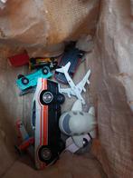 Tas met autootjes en vliegtuigjes, Ophalen