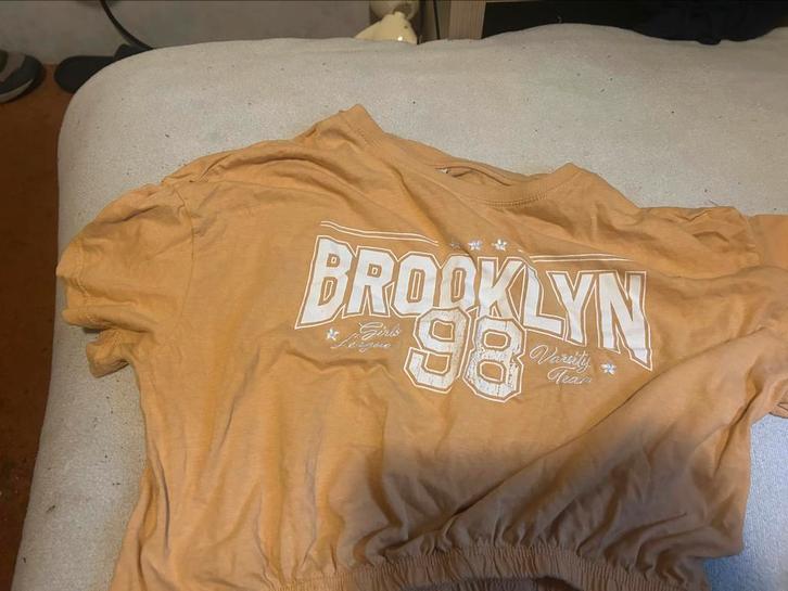 Oranje topje /buiktruitje met strikje, Kleding | Dames, Tops, Gedragen, Maat 38/40 (M), Oranje, Korte mouw, Ophalen of Verzenden