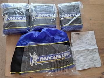 4 Michelin bandenhoezen met de logo mascotte Bibendum beschikbaar voor biedingen