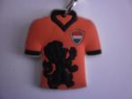 Sleutelhanger, Oranje voetbalshirt met zwarte leeuw, Ophalen of Verzenden, Gebruikt, Sport