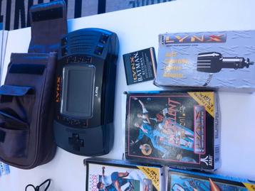 Atari II (niet werkend!), diverse spellen en auto oplader beschikbaar voor biedingen