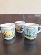 3 PORSELEINEN SUSKE en WISKE BEKERS., Huis en Inrichting, Keuken | Servies, Nieuw, Ophalen of Verzenden, Overige stijlen, Kop(pen) en/of Schotel(s)