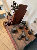 Oude weegschaal met gewichten, Ophalen