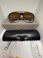 Dita Zonnebril - Inclusief Aankoopbon Bijenkorf, Overige merken, Zonnebril, Overige kleuren, Ophalen of Verzenden