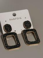 Zwarte en goud gekleurde oorbellen met prijskaartje, Met kristal, Overige materialen, Hangers, Zwart