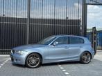 BMW 1-serie 130i High Executive LCI - AUTOMAAT - SCHUIFDAK -, Achterwielaandrijving, Gebruikt, Zwart, Blauw