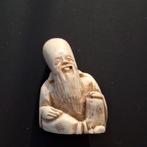 Netsuke Azië mannetje, Ophalen