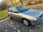 Opel Astra 1.4 I Tailgate 1995 Grijs, Auto's, Voorwielaandrijving, 4 cilinders, 1389 cc, Origineel Nederlands