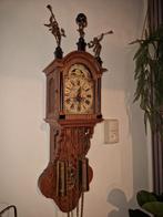 Friese staart klok, Ophalen