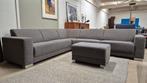 Royale 6 persoons grijze stoffen design hoekbank + hocker