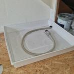 Lekbak en waterslot, Ophalen