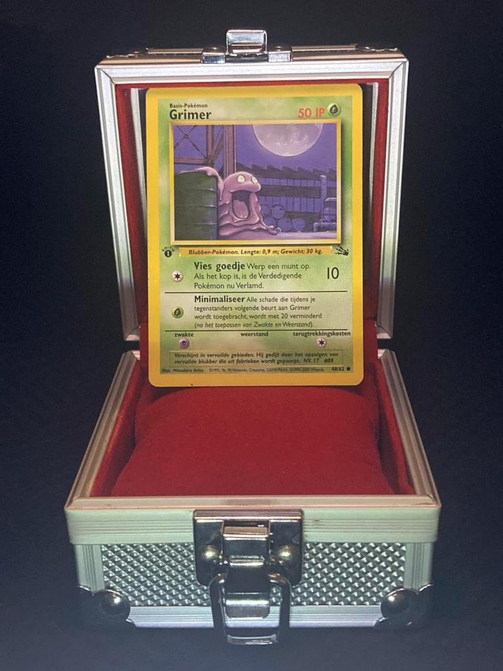 Grimer 1st edition - Fossil, Hobby en Vrije tijd, Verzamelkaartspellen | Pokémon, Zo goed als nieuw, Ophalen of Verzenden