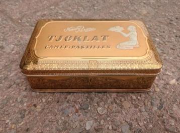 Vintage blik tjoklat beschikbaar voor biedingen