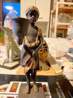 Een gietijzeren kandelaar / beeldje van een Moorse jongen., Antiek en Kunst, Antiek | Kandelaars, Overige materialen, Ophalen of Verzenden