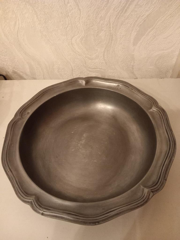 Tinnen schaal, Ophalen