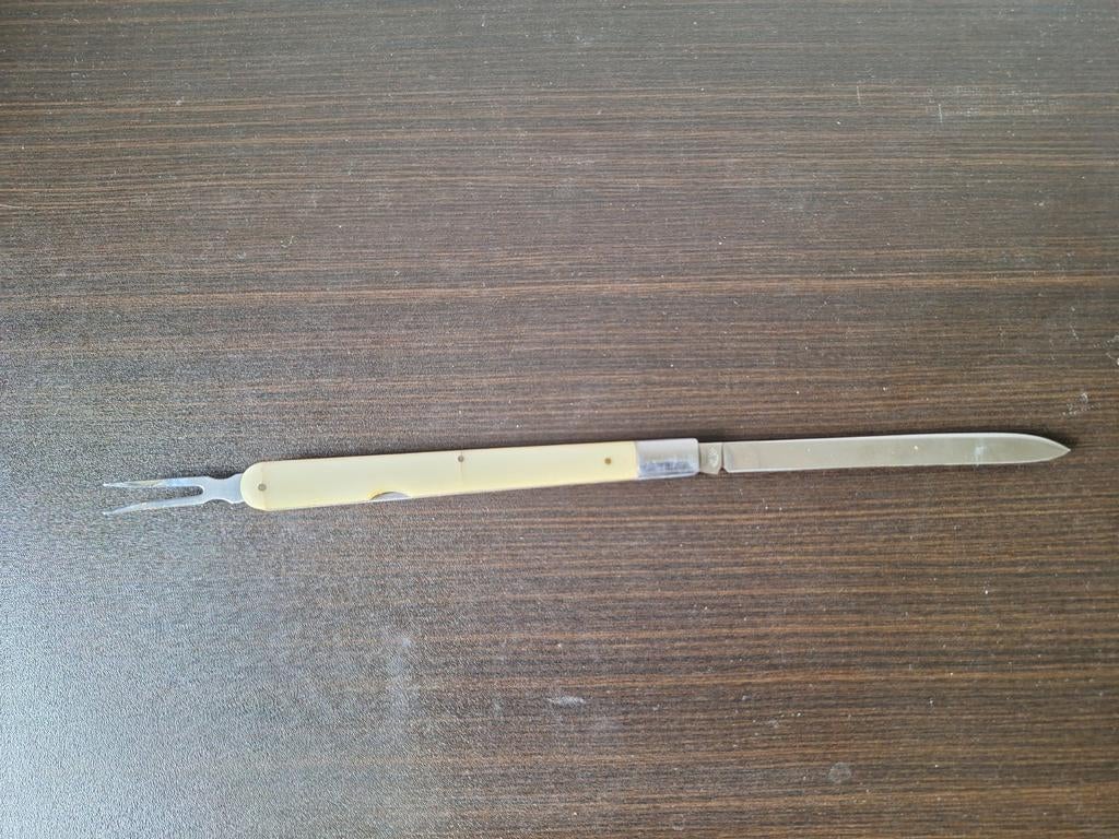 Vintage Solingen meloenmes met vrokje., Verzamelen, Ophalen of Verzenden, Gebruikt, Overige merken