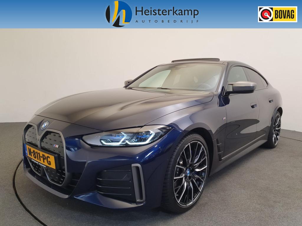 BMW i4 M50 High Executive 84 kWh M-Sport Plus Pack, Pano, HU, Auto's, BMW, 12 maanden, Gebruikt, Zwart, Blauw