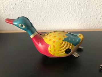 China 60's; wind up swimming duck met doos beschikbaar voor biedingen