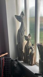 3 Houten katten, Ophalen