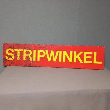 Vintage reclamebord van een stripwinkel beschikbaar voor biedingen