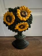 Gietijzeren deurstopper, Ophalen