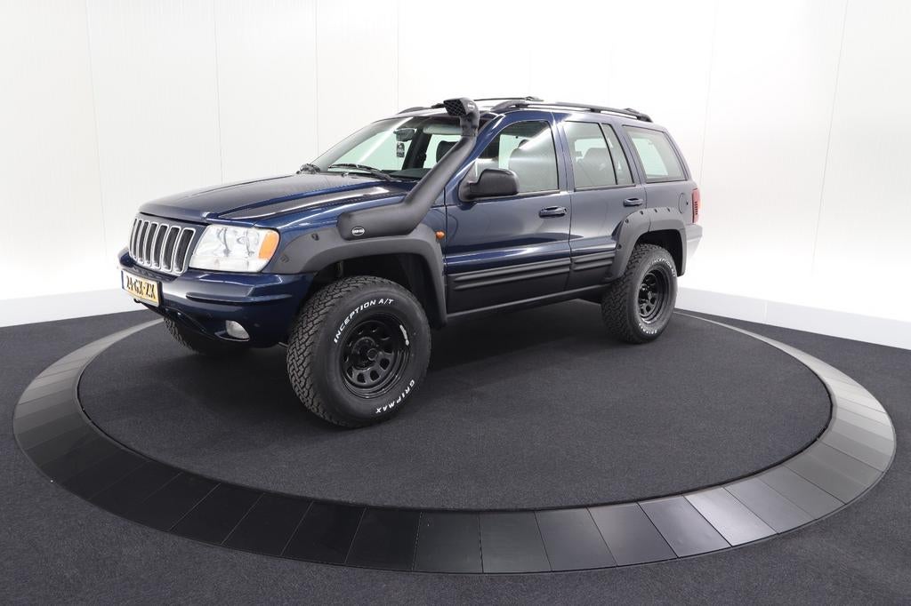 Jeep Grand Cherokee 4.7 I V8 Limited AUT 2001 Blauw, Auto's, Automaat, 1826 kg, Origineel Nederlands, 4701 cc