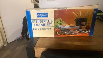 Voor een glim lach is deze stone grill & fondue set tekoop beschikbaar voor biedingen
