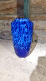 Blauwe geschilderde vaas, Ophalen