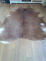 Mooi getekende koeienhuid of koeienvel, Ophalen