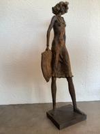 Vrouw met zonnehoed, Ophalen