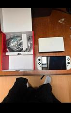 Nintendo switch oled met nieuwe accessoires !, Spelcomputers en Games, Ophalen of Verzenden, Zo goed als nieuw, Wit