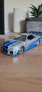 Nissan r34 skyline 1:24 modelauto., Ophalen of Verzenden, Zo goed als nieuw