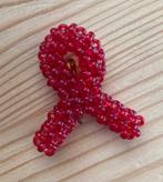 Speldje Aids lintje, gemaakt in Kenia, Ophalen of Verzenden, Zo goed als nieuw, Overige onderwerpen, Speldje of Pin