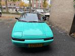 Mazda 323 1.6 I F GLX U9 1991  Tiffany Blue/Highloss Black, Auto's, Voorwielaandrijving, Stof, 4 cilinders, Origineel Nederlands