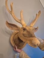 Hertekop van hout, Ophalen