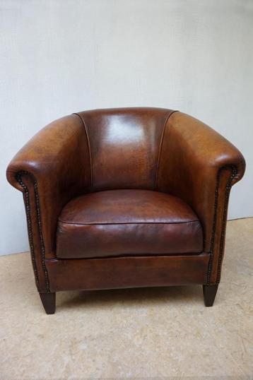 Vintage lounge clubfauteuil van schapenleer  beschikbaar voor biedingen