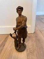 Bronzen beeld van een smid, Ophalen