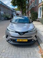 Toyota C-HR 1.8 Hybrid 122pk CVT 2019 Grijs, Auto's, 4 cilinders, Grijs, Dealer onderhouden, 1395 kg