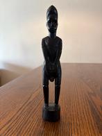 Afrikaans Houten Beeldje, Ophalen