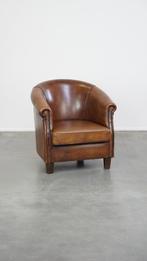 Subtiele schapenleren clubfauteuil met een vast zitkussen, Huis en Inrichting, Fauteuils, Ophalen, Gebruikt, Vintage, 50 tot 75 cm