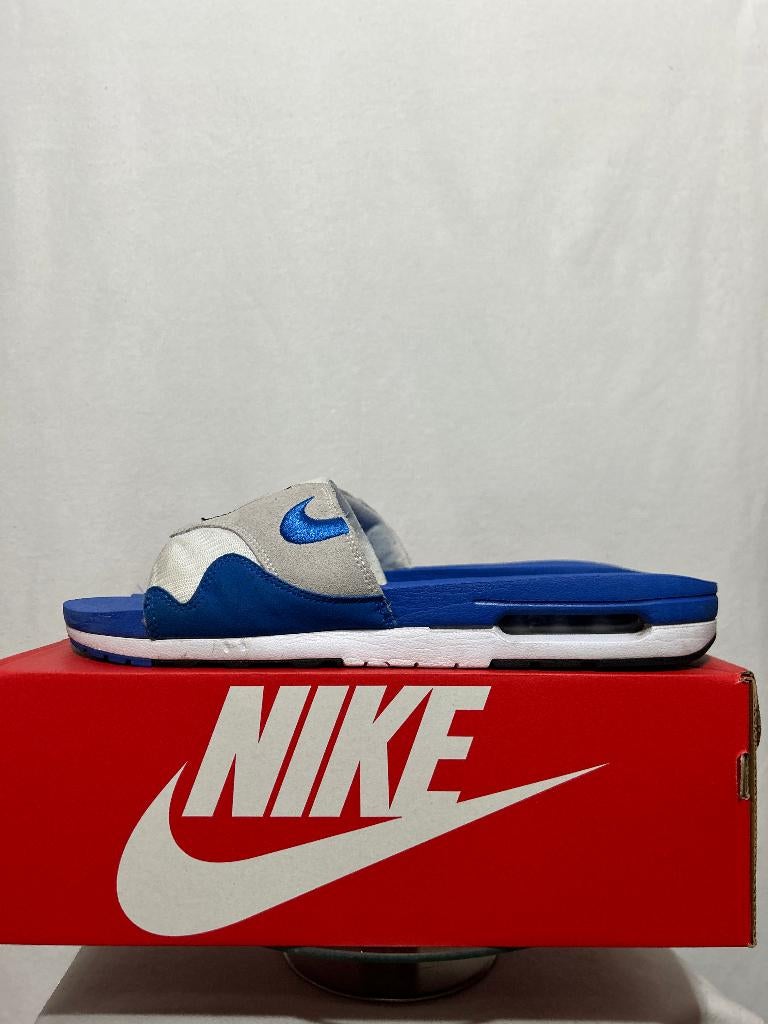 ALS NIEUW! Maat 49,5 - Nike Air Max 1 Slide Royal Blue, Kleding | Heren, Schoenen, Slippers, Nike, Zo goed als nieuw, Nike