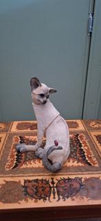 Siamees beeldjes., Ophalen