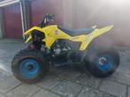 Gele Suzuki quad
