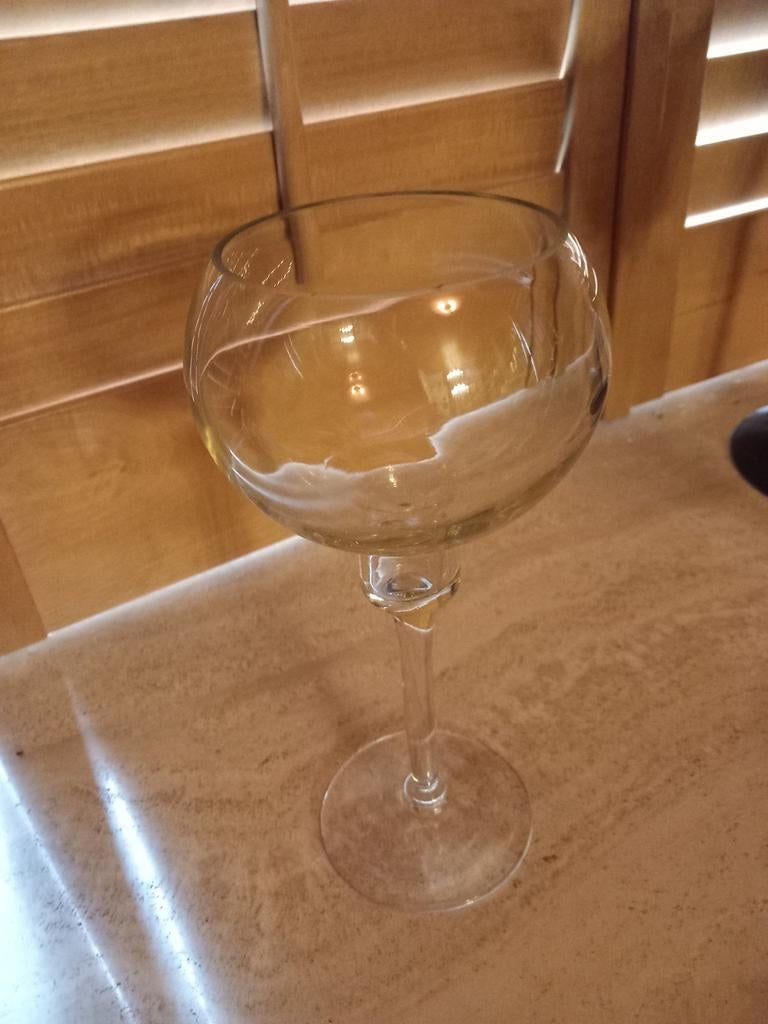 Glazen waxinelichthouder op voet met kaars, Ophalen