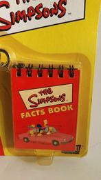 The Simpsons Fact Books sleutelhanger, nieuw. 5C2, Verzamelen, Film en Tv, Gebruikt, Ophalen of Verzenden