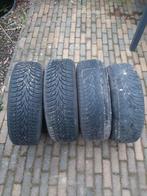 4 Winterbanden Nokian op velg + wieldoppen volvo, Ophalen, Gebruikt, 15 inch, Banden en Velgen