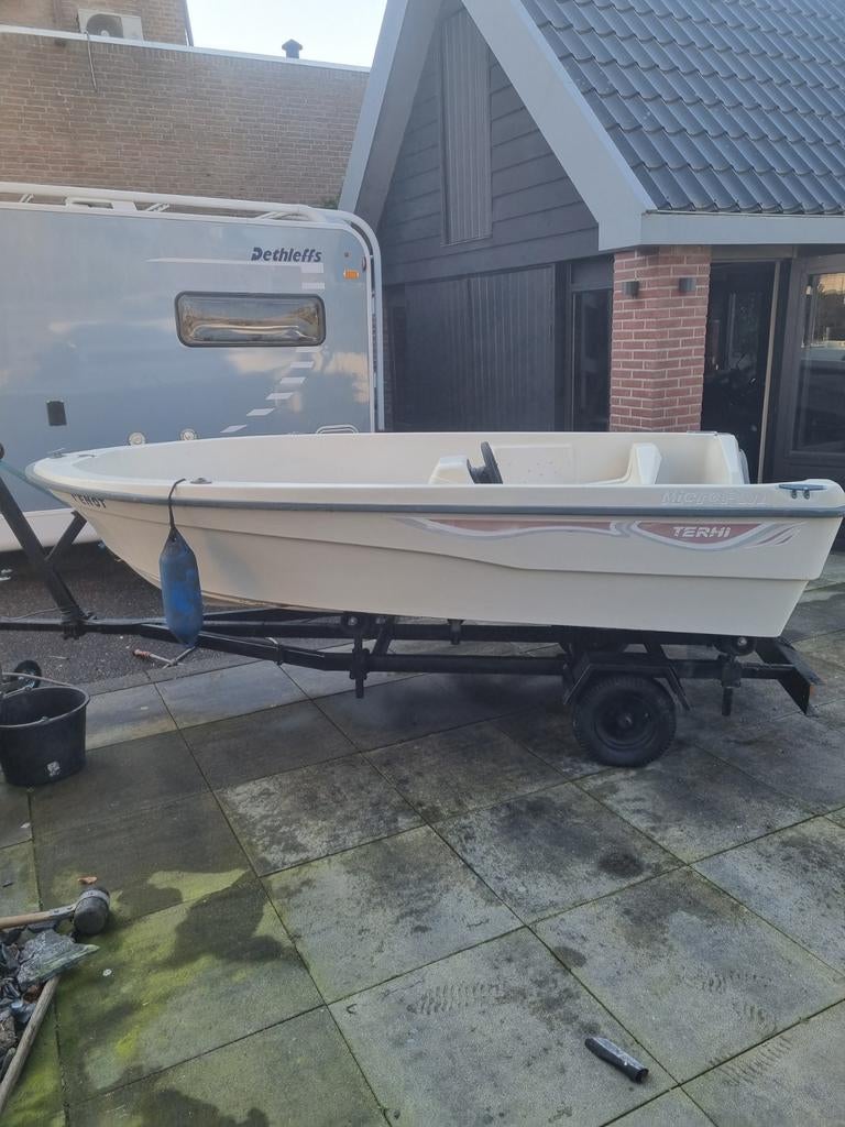 Tour of visbootje merk terhi met trailer, Ophalen of Verzenden